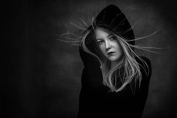 istock scared girl in hood 540607720