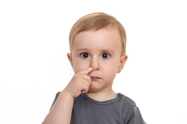 istock picking nose cute baby boy isolated on white 540608028