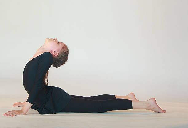 istock dhanurasana yoga 540609878