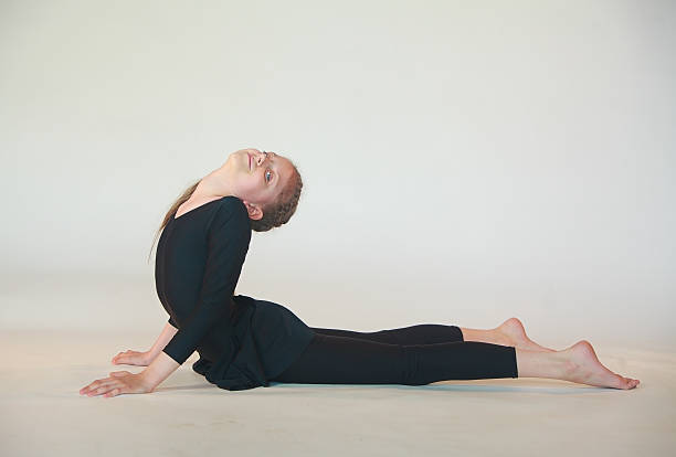 istock dhanurasana yoga 540609884