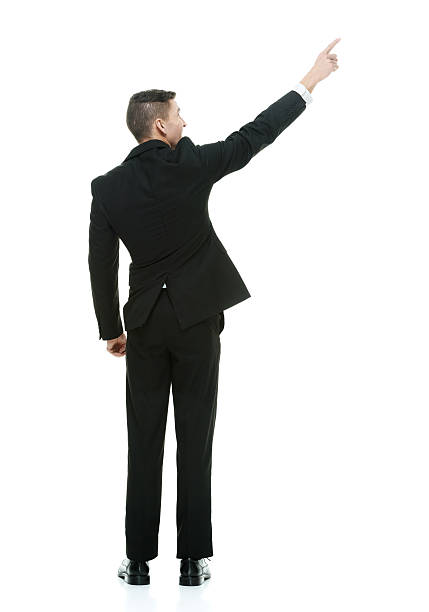 istock Rear view of businessman pointing away 540610890
