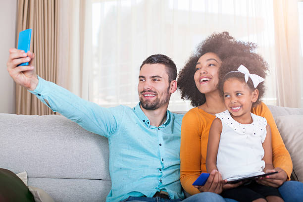 istock Happy family take a selfie with smart phone 540611248
