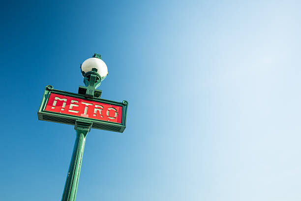 Paris Metro Sign Metro sign for subway in Paris, France paris metro sign stock pictures, royalty-free photos & images