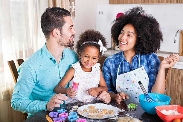 istock Young happy family baking together 540716942