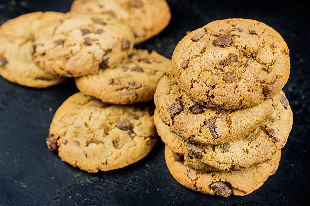 istock Chocolate chips cookies isolated on black background 540717360