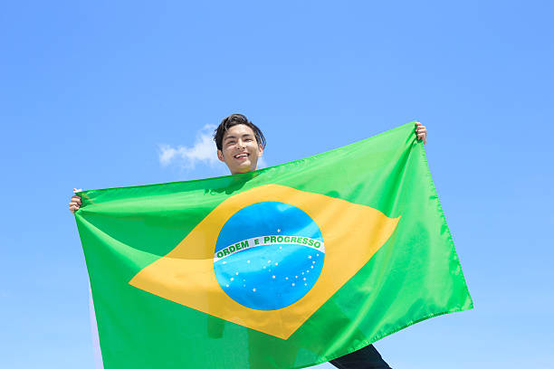 istock Excited man holding brazil flag 540720978