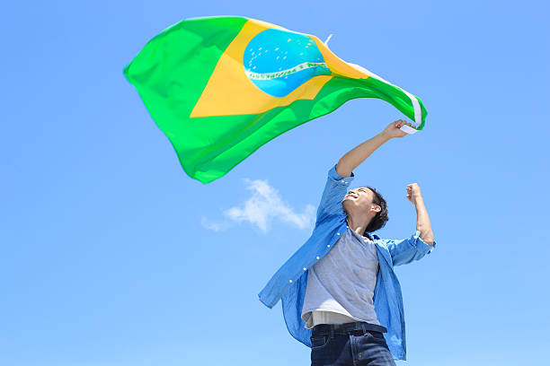 Excited man holding brazil flag