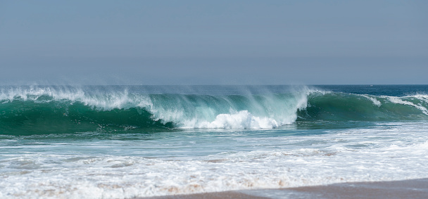 Beautiful wave breaking on California beach, Newport Beach, Ca.