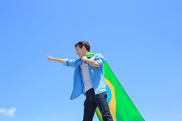 istock Excited man holding brazil flag 540721046
