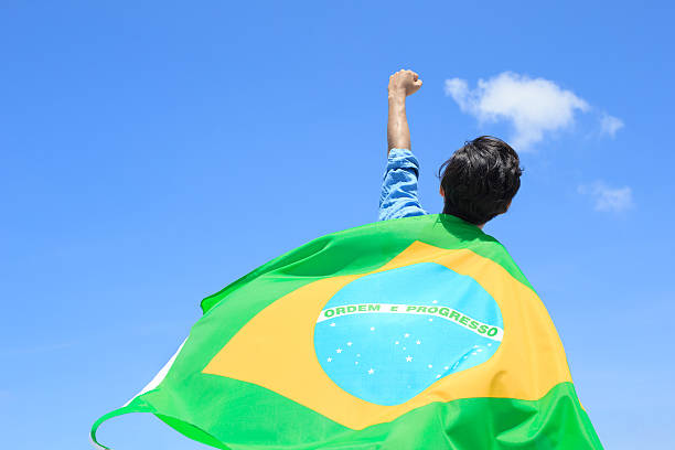 istock Excited man holding brazil flag 540721198
