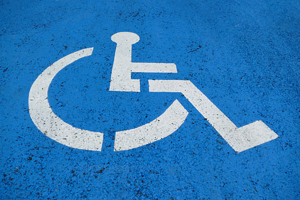 istock Wheelchair Sign on blue asphalt 540725266