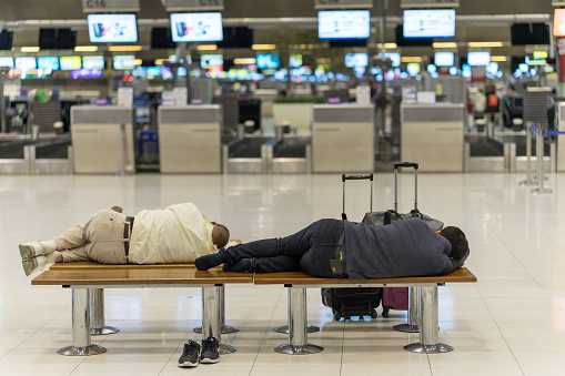 Bangkok, Thailand - march 1, 2016: People sleeping in night airport terminal Suvarnabhumi  while waiting fly