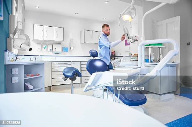 Young Male Dental Nurse Or Dentist Stock Photo - Download Image Now - Dentist, Dentist's Office, Dental Health