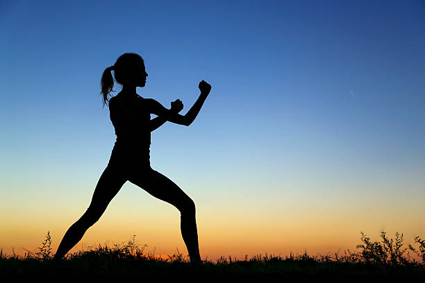 Silhouette body of Young Fitness Woman play sweat Yoga and stretch muscle for slim sexy shape. High contrast white background copy space