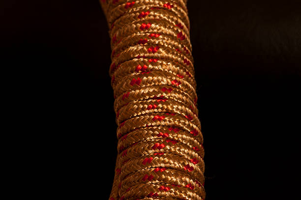 istock Gold and metallic red rope showing textures 540728802