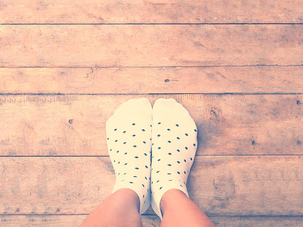istock feet wearing white polka dot socks 540729760