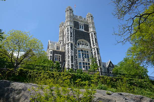 Shepard Hall Tower of City College of New York Shepard Hall Tower of City College of New York in Harlem. This is the tower of Shepard Hall, the largest building and the centerpiece of the campus, which was modeled after a Gothic cathedral plan. The City College of New York (CCNY) is a senior college of the City University of New York. Established in 1847 it is the oldest of City University's twenty-four institutions of higher learning. City College's 35-acre (14 ha) Manhattan campus along Convent Avenue from 130th to 141st Streets is on a hill overlooking Harlem. The photo is made from St. Nicholas Park. harlem park stock pictures, royalty-free photos & images
