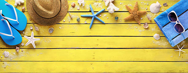 Beach Accessories On Yellow Wooden Plank - Summer Colors Beach Accessories On table, Top View  starfish sunglasses stock pictures, royalty-free photos & images