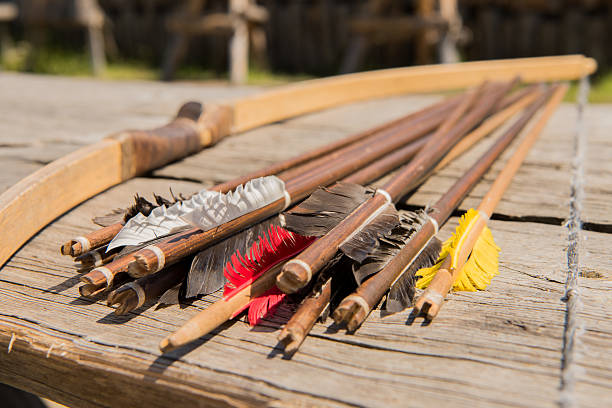 istock Bow arrows historic desk sunny day 540730248