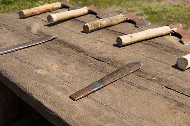 istock historical knives axes on the table summer day 540730744