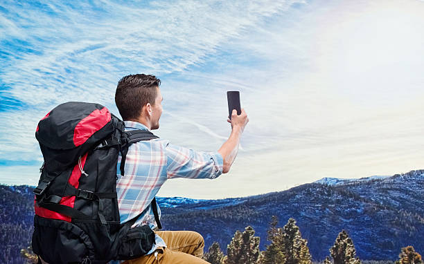 istock Rear view of hiker taking a selfie 540730816