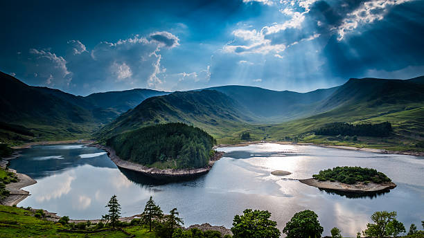 Sun rays on Haweswater Sun rays on Haweswater, The Lake District, Cumbria, England reservoir photos stock pictures, royalty-free photos & images