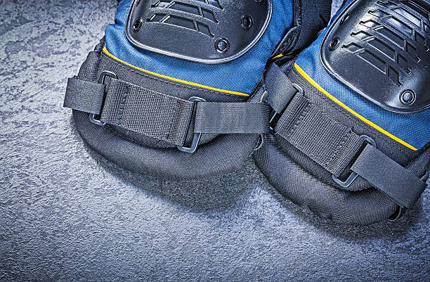 istock Safety knee pads on black background construction concept 540731172