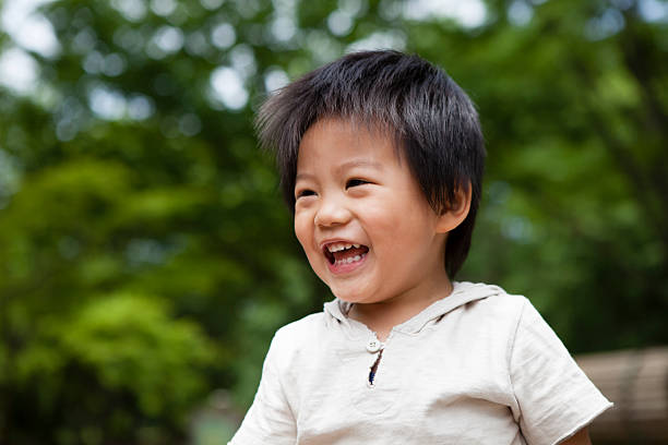 istock Boys holiday to laughing in the park 540732924