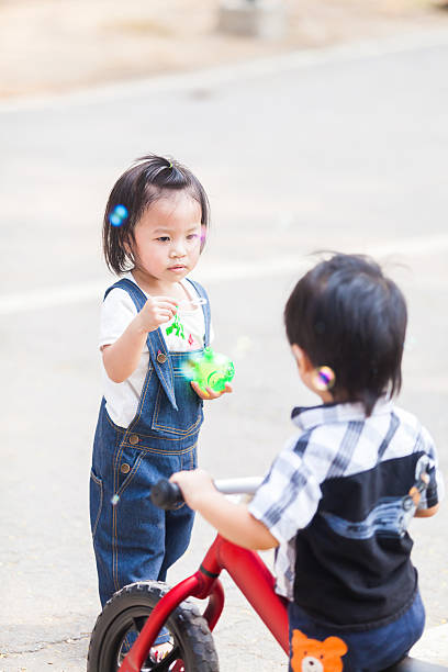 istock Cute Kids 2-3 Year Old Playing Bubble in the garden 540733180