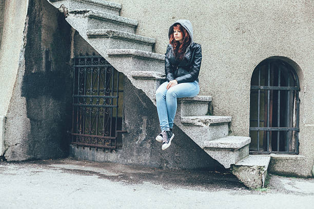 Unhappy teenage girl outside