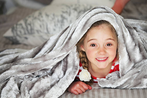 istock Under duvet girl 540735062