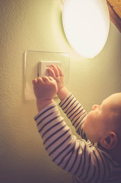 istock Baby child switching on / off the light 540735474