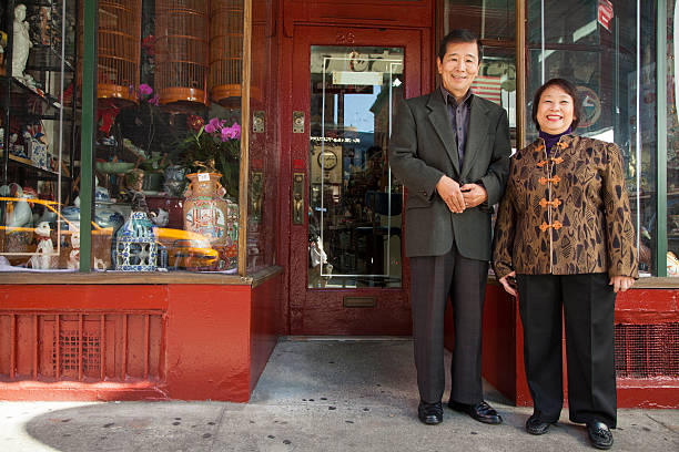 istock Asian family in front of store 540738604
