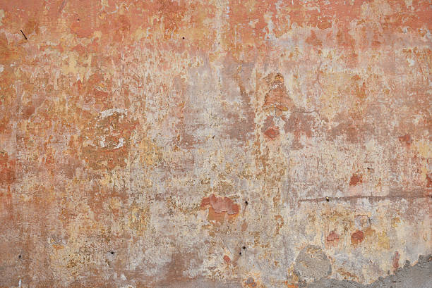 Old weathered and worn stucco wall stock photo