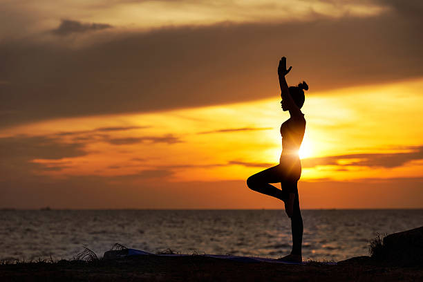 yoga Woman Yoga - relax in nature yoga stock pictures, royalty-free photos & images