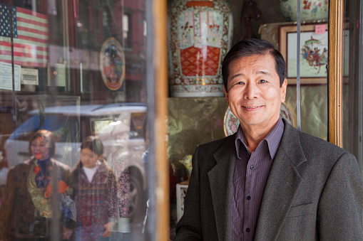 Asian family in front of store