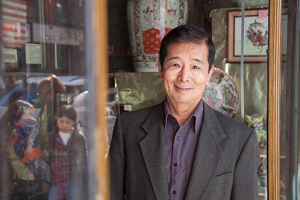 Asian family in front of store