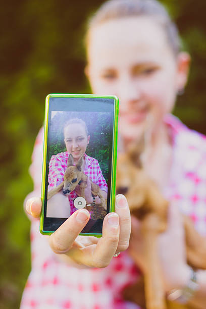 istock Young woman selfie with a little derr 540745346