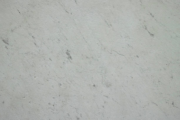 Finely textured worn veined marble travertine stone stock photo