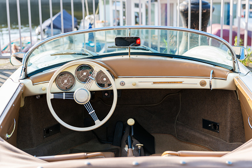 Düsseldorf, Germany - June 9, 2016: Close-up of the seats and steering wheel of an old Porsche 365A Speedster 1600 Super parked in front of the port in Düsseldorf, Germany.
