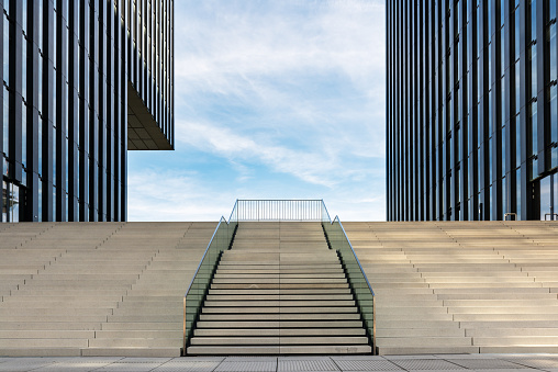 Wide stairway between two modern office buildings at the Medienhafen (media harbour) in Düsseldorf, Germany.