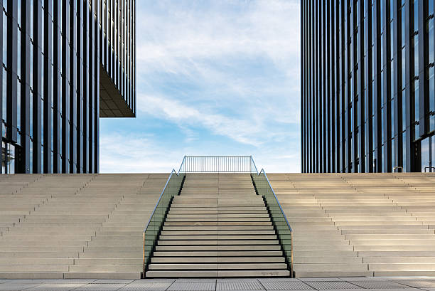 Empty stairs in the Media Harbour in Düsseldorf Wide stairway between two modern office buildings at the Medienhafen (media harbour) in Düsseldorf, Germany. media harbor photos stock pictures, royalty-free photos & images