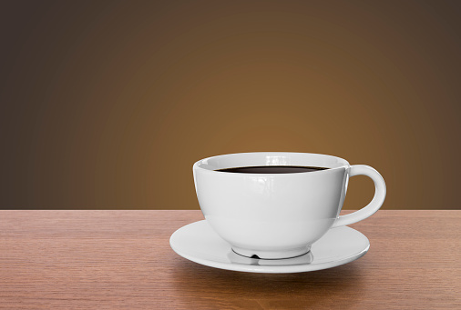 white coffee cup and hot espresso on wooden table