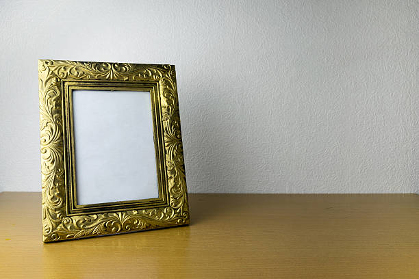 istock photo frame on wooden table 540748536