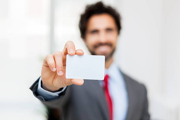 istock Smiling businessman showing a blank card 540748770