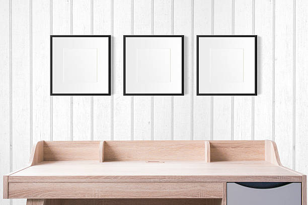 istock working table with photo frames in the studio, wood wall 540748828