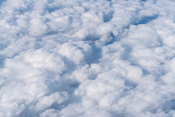 istock Clouds and sky as seen through window of an aircraft 540748838