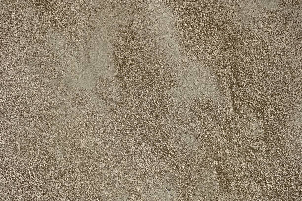 Rough sandy texture stucco wall background stock photo