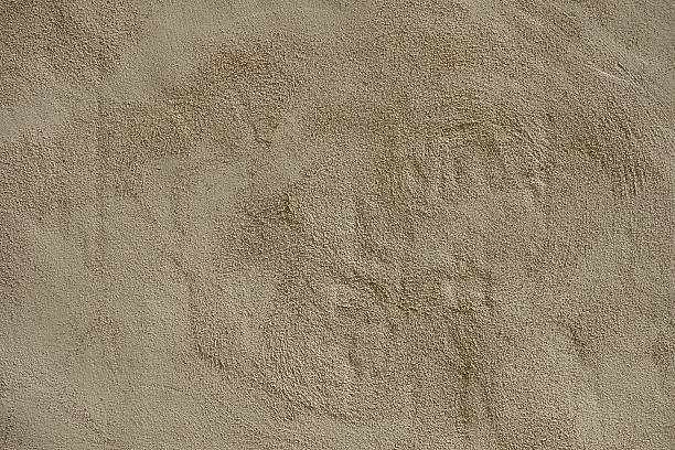 Rough sandy texture stucco wall background stock photo