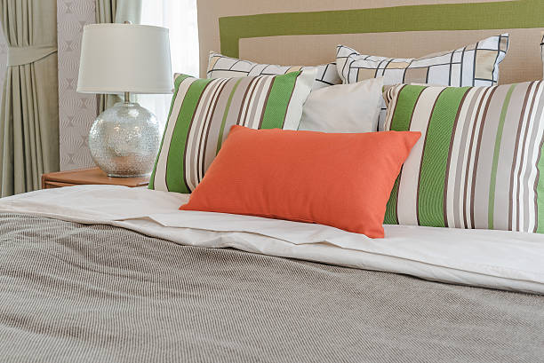 istock colorful pillows on white bed in modern bedroom 540751098